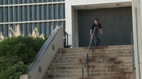 Skateboarder Slides down Ledge Stock Footage 27829972