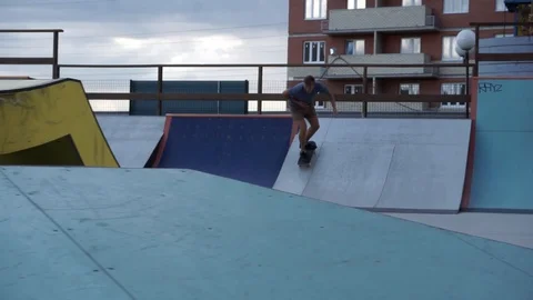 Skateboarder slides on railing Stock-Footage 102248898
