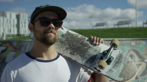 Skateboarder smiling at camera Stock Footage 66860999