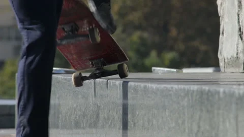 Skateboarder try a grind trick on ledge and stops, close-up view in slowmotion Stock Footage 96719431