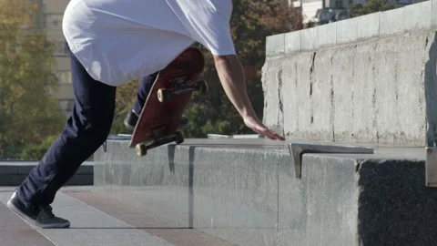 Skateboarder try a grind trick on ledge and falling down, slowmotion Stock Footage 96719919