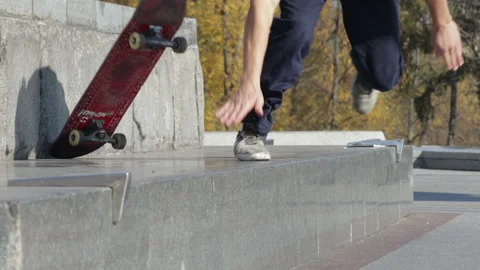 Skateboarder try a grind trick on ledge and falling down, slowmotion Stock Footage 96771815