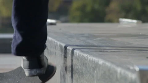 Skateboarder try grind trick on ledge and skate truck jumps off the edge Stock Footage 96773418