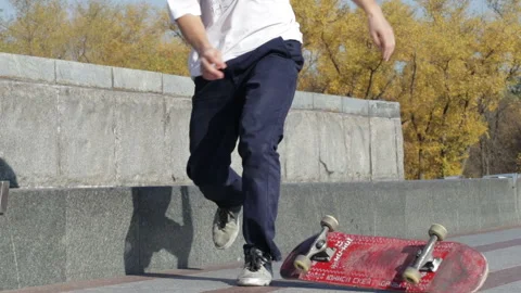 Skateboarder try grind trick on ledge and skate nose jumps off the edge Stock Footage 96774464