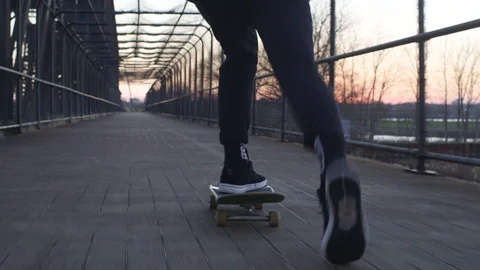 Skateboarding on bridge at sun set Stock Footage 88377719