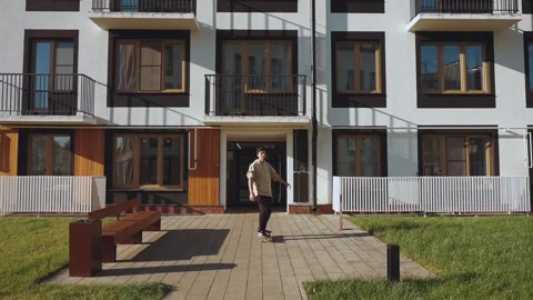 Skateboarding in the residential complex Stock Footage 323836806