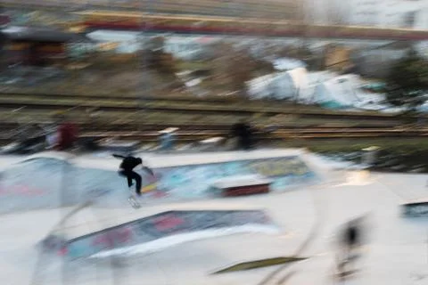 A skater in Berlin with a train in the background Stock Photos