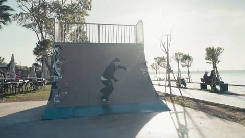 Skater boy practicing at skate park. Young man doing skateboard tricks at Stock-Footage 194454863