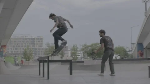 Skater Does a 360 Over a Rail Stock Footage 100970644