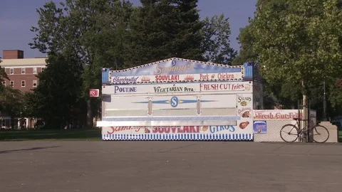 Skater does trick in empty carnival grounds Stock Footage 84516359