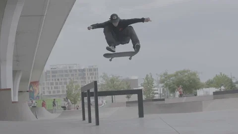 Skater Does a Trick at a Skatepark Stock Footage 100971082