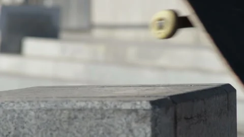 Skater doing slide trick front boardslide on the street bench, slowmotion Video stock 96723599