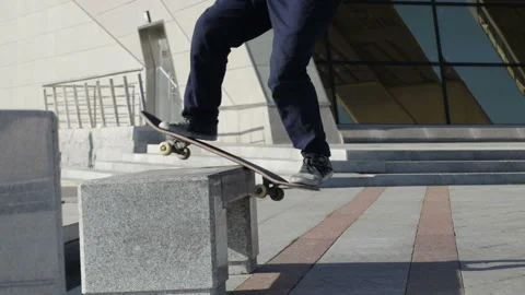 Skater doing slide trick front boardslide on the street bench, slowmotion Stock Footage 96724538
