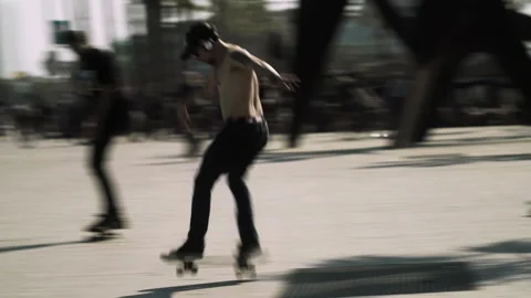 Skater doing a trick on the promenade Stock Footage 230890678