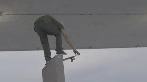 Skater Drops Down a Ramp in Slow Motion Stock Footage 100970686
