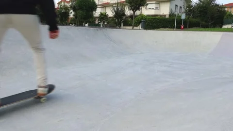 A Skater Falls Off His Board While Practicing at the Skate park, 4k slow moti Stock Footage 285765956