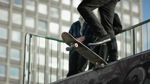 Skater jumps into halfpipe Stock Footage 61751174