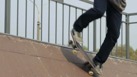 Skater make beautiful spin trick on the edge of wooden mini ramp, slowmotion Stock Footage 96237264