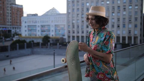 Skater smiling while networking on phone outdoor Stock Footage 112674128