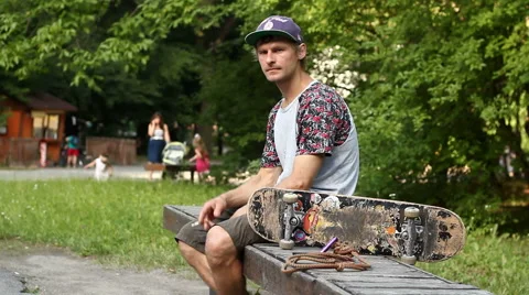 Skater Smokes on the Bench Stock Footage 52196288