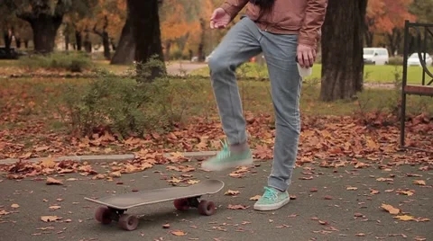 Skater while picking up skateboard continue walking slow motion Stock Footage 68354062