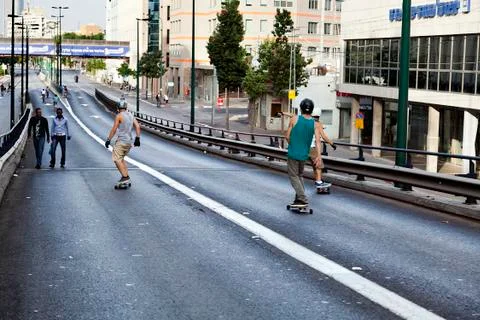 Skaters on a bridge Stock Photos