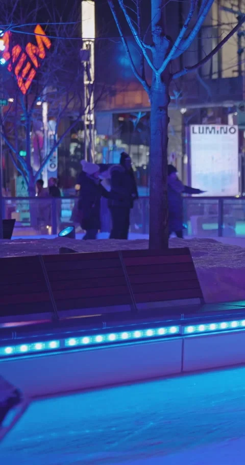 Skaters In An Immersive Blue Light Ice Rink Experience In Montreal Stock Footage 334136036