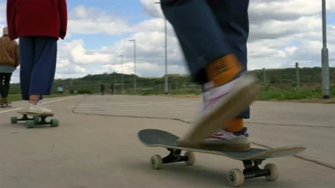 Skaters skating down a hill Stock Footage 194139689