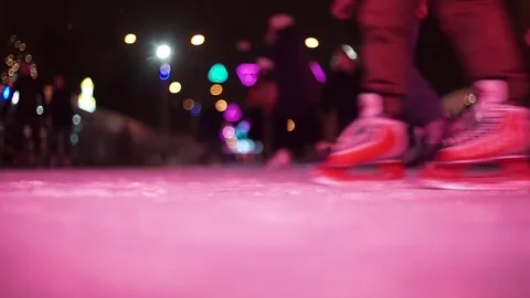 Skates glide on the ice rink at the evening Stock Footage 72613645