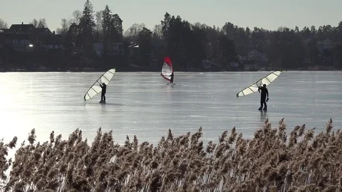 Skating on the ice in winter with a Kitewing Stock Footage 72735148