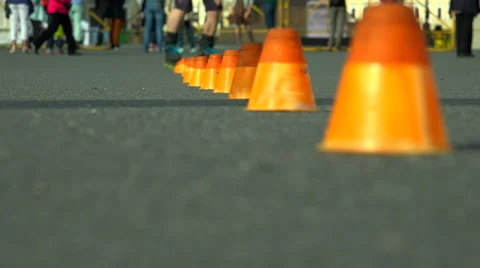 Skating on roller skates between cones. The snake. 4K. Video stock 39004676