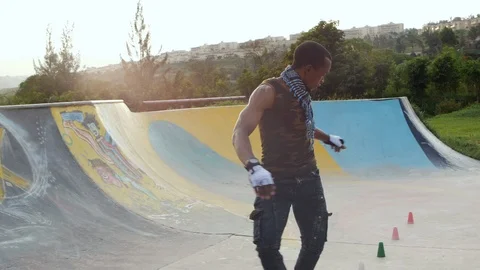 Skating in slow motion on roller skates between cones. Stock Footage 110853434