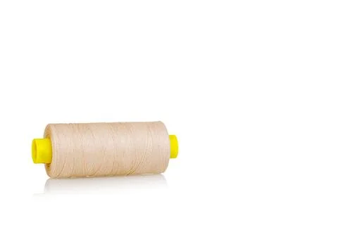 Skein of beige color thread macro on a white background Stock Photos