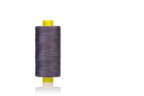 Skein of gray thread macro on a white background Foto stock