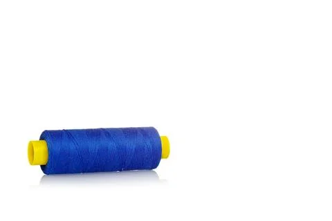 A skein of threads of blue color macro on a white background close up Stock Photos