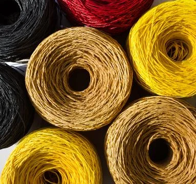 Skeins of multi-colored raffia are ready for knitting. Eco material for han.. Stock Photos