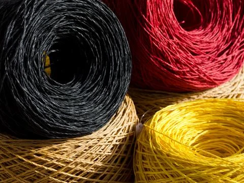 Skeins of multi-colored raffia are ready for knitting. Eco material for han.. Stock Photos