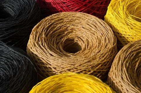 Skeins of multi-colored raffia are ready for knitting. Eco material for han.. Stock Photos