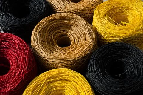Skeins of multi-colored raffia. Eco material for handmade work. Stock Photos