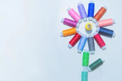Skeins with threads are in the form of a creative flower on a white background Stock Photos