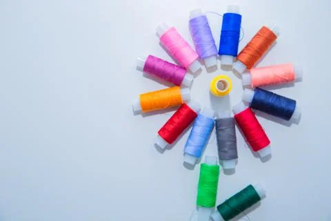 Skeins with threads are in the form of a creative flower on a white background Foto stock