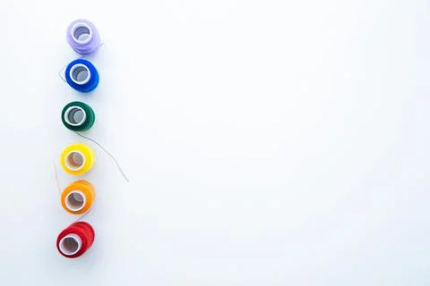 Skeins with threads are lined up in a row according to the color of the rainbow Stock Photos