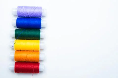 Skeins with threads are lined up in a row according to the color of the rainbow Stock Photos