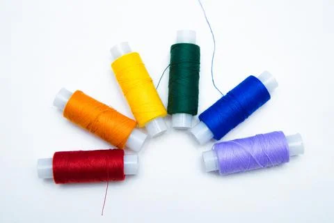 Skeins with threads are lined up in a row according to the color of the rainbow Stock Photos
