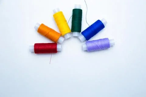 Skeins with threads are lined up in a row according to the color of the rainbow Stock Photos