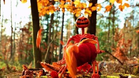 Skeleton in autumn forest in the bright rays of the sun.Screamer effect Stock Footage 308575012