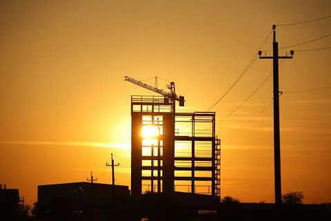 The skeleton of the construction of a skyscraper under construction with a to Stock Photos