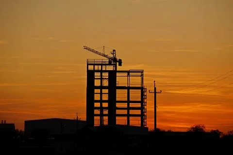 The skeleton of the construction of a skyscraper under construction with a to Stock Photos