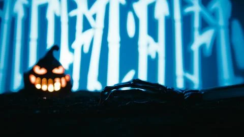 Skeleton Hand Crawling with Evil Pumpkin Head Stock Photos