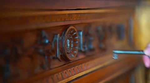 Skeleton key going into old keyhole lock Stock Footage 64568138